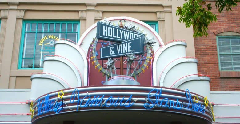Hollywood & Vine restaurant in classic Art Deco architecture, glowing neon sign inviting guests at Disney’s Hollywood Studios.