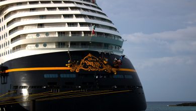 The Disney Dream cruise ship’s bow featuring beloved Disney characters painted next to the iconic ship name.