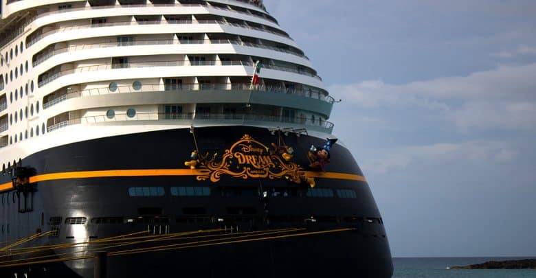 The Disney Dream cruise ship’s bow featuring beloved Disney characters painted next to the iconic ship name.