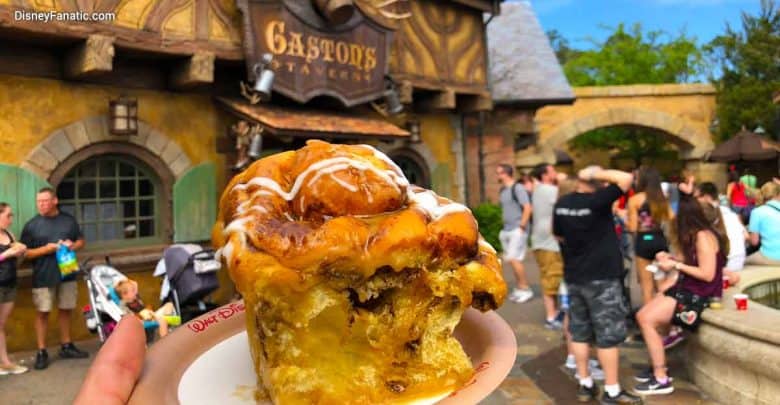 The famous cinnamon roll from Gaston’s Tavern held up, the ultimate Magic Kingdom breakfast treat for Disney fans on-the-go.