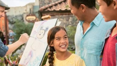 Family observing artist at EPCOT