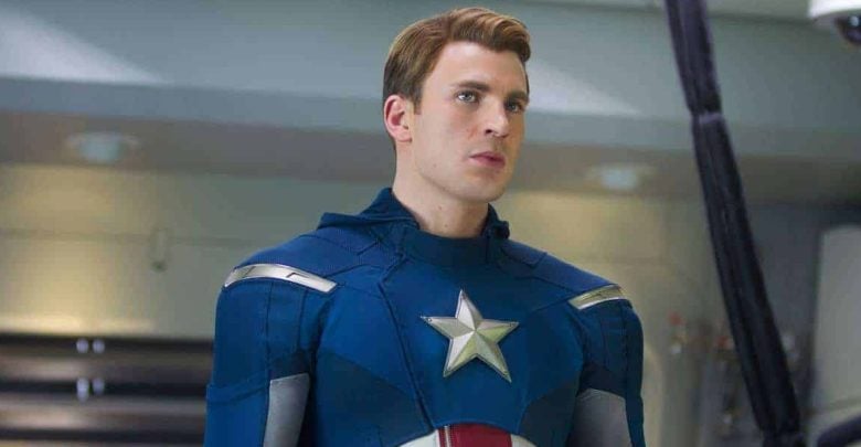 Captain America in his classic blue suit with a star emblem poses heroically inside an Avengers-themed attraction.