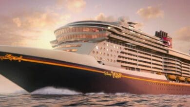Disney Wish cruise ship cruises the ocean at sunset, promising magical Disney experiences on board.
