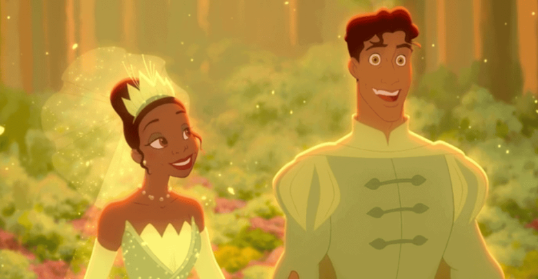 Princess Tiana in her green gown and Prince Naveen greet guests with smiles in an enchanting, illuminated forest at Disneyland.