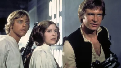 Han Solo, Leia, and Luke pose together with blasters drawn, ready for adventure in Star Wars: Galaxy’s Edge.