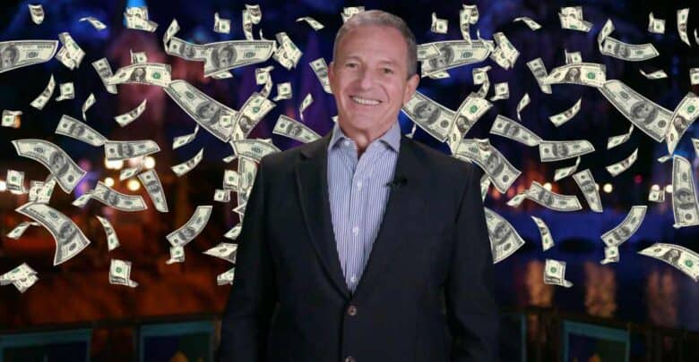 A smiling man in a suit stands in front of a background with flying dollar bills, giving the impression of money raining down.