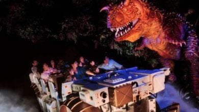 Guests ride DINOSAUR