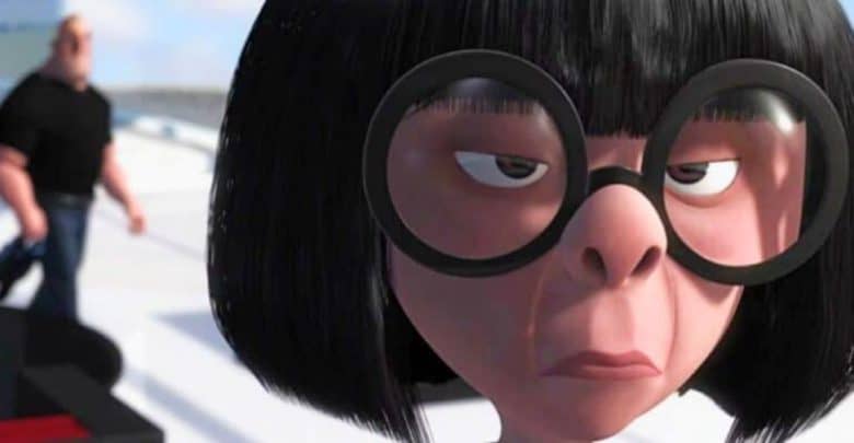 A close-up of a Pixar character with straight black hair, large round glasses, and an unimpressed expression. In the background, a muscular character in a black shirt and blue pants is walking away, slightly out of focus.