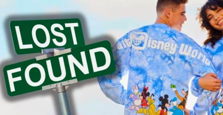A "Lost and Found" sign is positioned beside a smiling young couple. They both wear matching light blue Disney World shirts with cartoon character prints on the back, perfectly capturing the whimsical Disney spirit. The background is a clear, blue sky.
