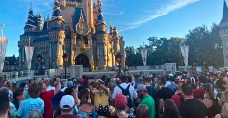 Crowds gathering around Cinderella Castle in Magic Kingdom at Disney World