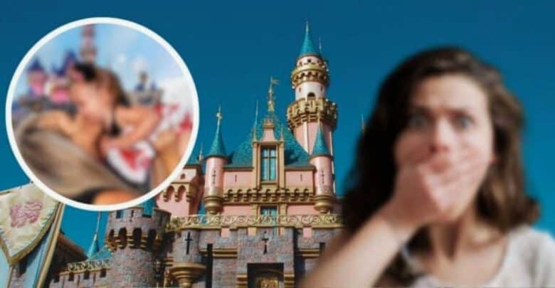 A woman with a surprised expression covers her mouth with her hands in front of a fairy-tale castle at Disneyland. In an inset circle to the left, a blurry image shows two people in an amusement park setting. The sky is clear and blue.