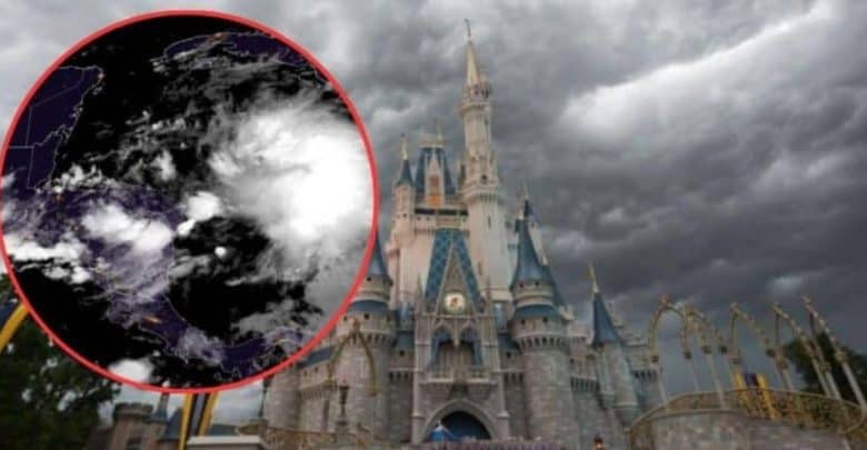A large stone castle with blue roofs and golden spires stands under a dark, cloudy sky. An ominous satellite image of a developing storm is superimposed in a red circle on the left side of the image, highlighting the approaching weather threat.