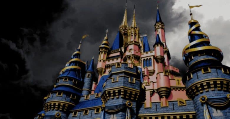 A majestic castle with blue and gold turrets stands against a dramatic, stormy sky. The dark clouds provide a contrasting backdrop, highlighting the intricate architectural details and vibrant colors of the castle structure.