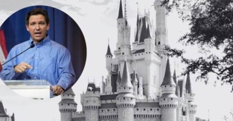 A black-and-white image of a castle with an inset color photo of a man speaking at a podium on the left. The man is wearing a blue shirt.