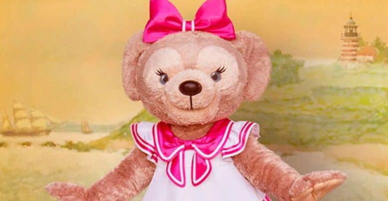 ShellieMay wearing a dress and pink bow