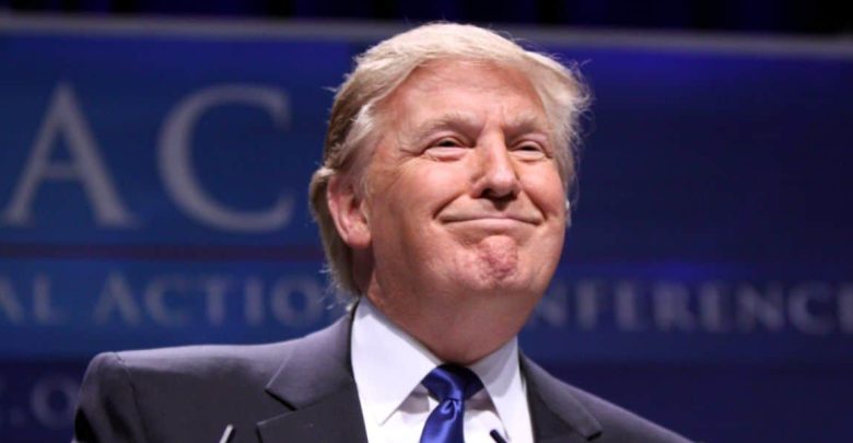 Donald Trump smiles during a speech.