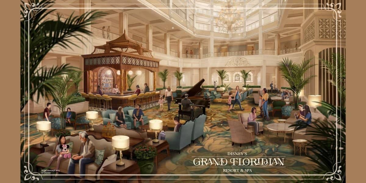 Elegant hotel lobby with high ceilings, a grand piano, and intricate decor. Guests relax on plush seating, surrounded by lush plants and ornate detailing. A bar with a canopy is nearby. Sign reads "Disney's Grand Floridian Resort & Spa.