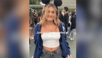 A young woman wearing Mickey Mouse ears and a white tube top that violated the Disney dress code.