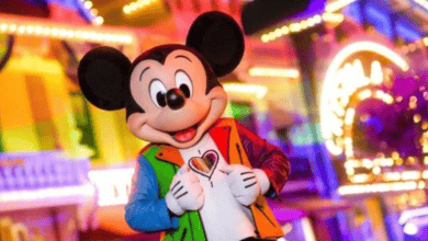 Mickey Mouse poses in his Pride merchandise on Main Street in Disneyland