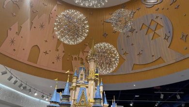 A detailed model of a Cinderella Castle inside the Disney Store at Orlando International Airport