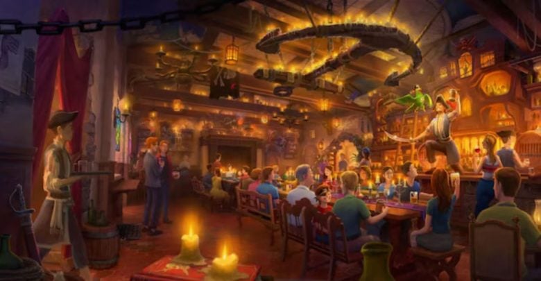 A lively, warmly lit tavern scene with people eating, drinking, and socializing. Amidst Disney World Renovations, a performer with a green bird captivates patrons as candles, wooden furniture, and rustic decor fill the bustling room.
