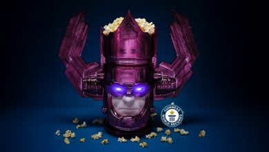 A purple robot-like helmet, resembling Marvel's Galactus, is filled with popcorn, with some popcorn scattered around. The helmet's eyes glow purple, and a Guinness World Records badge is displayed in front.