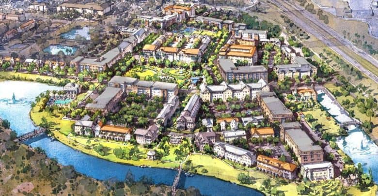 A colorful aerial illustration of a planned mixed-use community with apartment buildings, green spaces, tree-lined streets, and a river curving around the development; roads and highways are visible in the background.