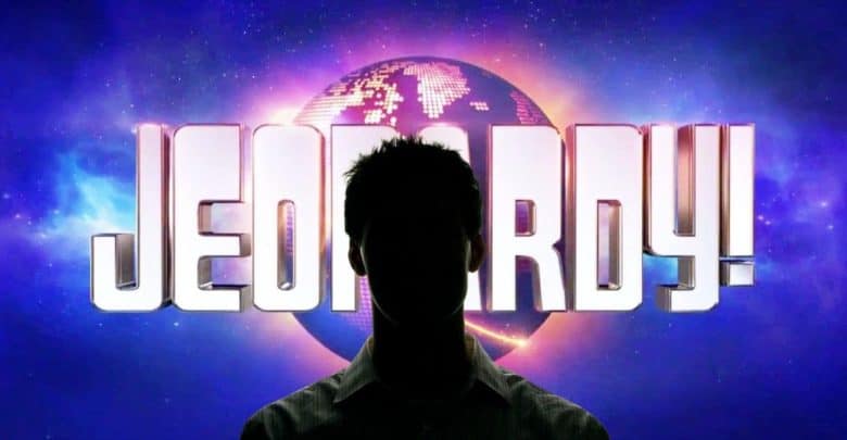 A silhouette of a person stands in front of a glowing Jeopardy! game show logo, with a stylized globe in the background, capturing the excitement of the Jeopardy challenge.