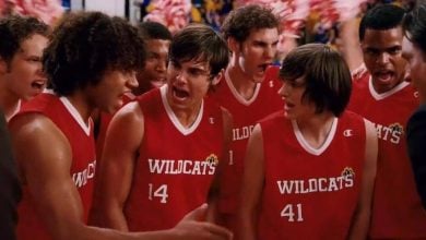 Wildcats basketball team huddles with game-day focus, channeling Disney’s high-energy spirit of teamwork and excitement.