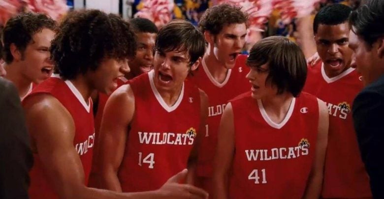 Wildcats basketball team huddles with game-day focus, channeling Disney’s high-energy spirit of teamwork and excitement.
