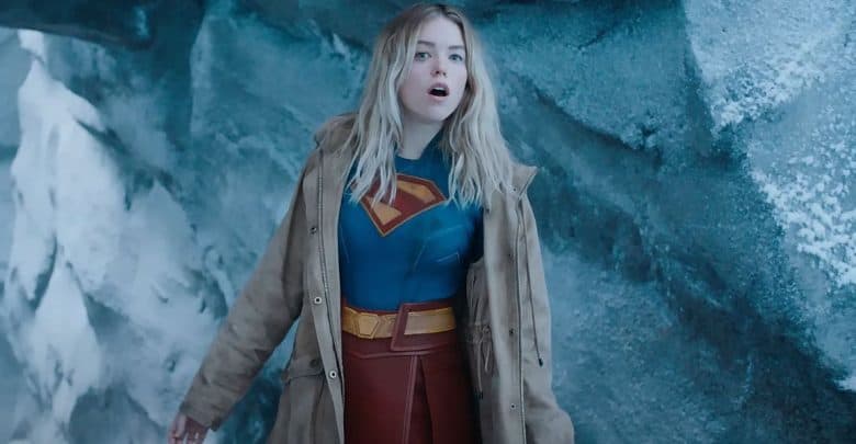 Supergirl with a coat over her costume
