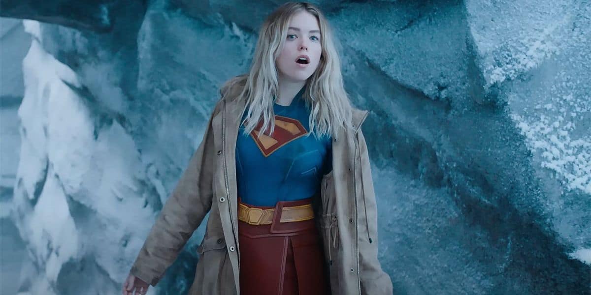 Supergirl with a coat over her costume