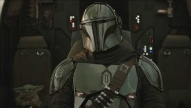 The Mandalorian and Grogu experience a thrilling adventure in the Star Wars: Galaxy’s Edge cockpit, surrounded by iconic controls.