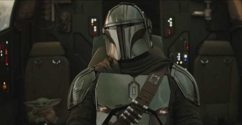 The Mandalorian and Grogu experience a thrilling adventure in the Star Wars: Galaxy’s Edge cockpit, surrounded by iconic controls.