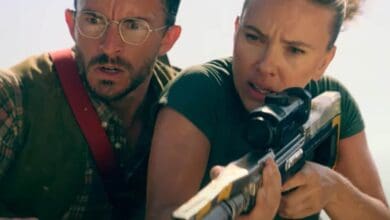 Claire aims a rifle as Owen looks on, both tense, in a high-stakes Jurassic World Rebirth 2 scene fans can't wait to see.