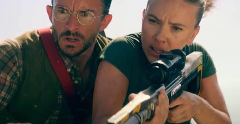 Claire aims a rifle as Owen looks on, both tense, in a high-stakes Jurassic World Rebirth 2 scene fans can't wait to see.