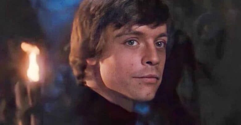 A Luke Skywalker lookalike glances back in a moody, torch-lit scene, evoking Star Wars vibes for park guests.