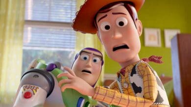 Woody and Buzz Lightyear appear amazed inside a vibrant, Toy Story-themed room like one at Disney's Hollywood Studios.