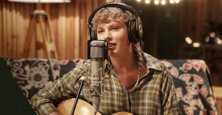 A performer with headphones rocks out on guitar and sings into a mic, creating pop-star magic in a studio setting.