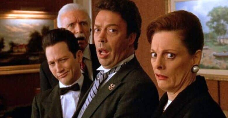 Four guests dressed in their best evening attire stand together in a themed Disney resort lounge, their faces full of shock and intrigue, as if they’ve just uncovered the surprise behind a secret Imagineering door or stumbled into a mystery straight out of an interactive Disney live show.