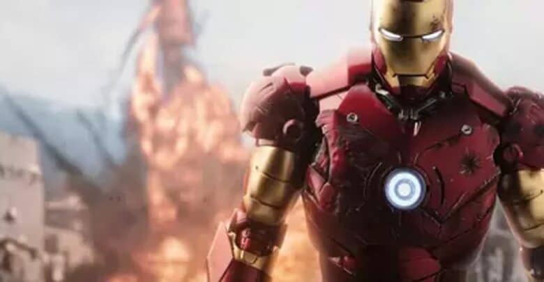 Iron Man, brought to life by Robert Downey Jr., stands heroically in his signature red armor, surrounded by swirling smoke and bursts of special effects on a thrilling Avengers Campus attraction stage.