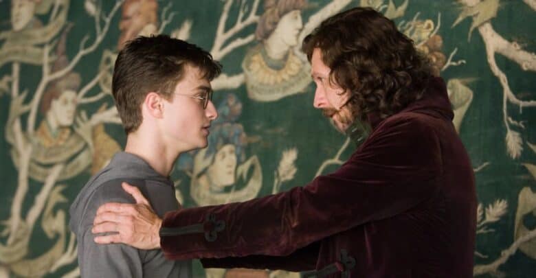 Sirius Black holding Harry Potter