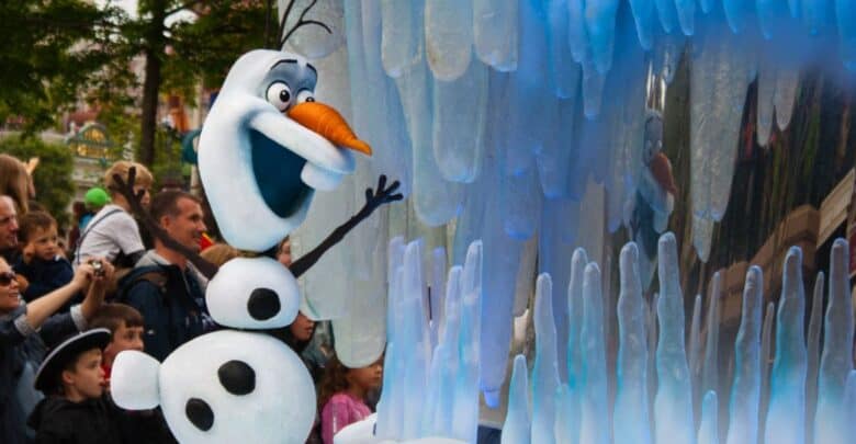 Olaf waving from the Frozen Ever After float at Disney World.