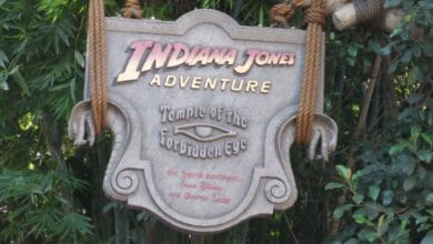 The Indiana Jones Adventure: Temple of the Forbidden Eye sign at Disneyland, a popular rope drop destination.