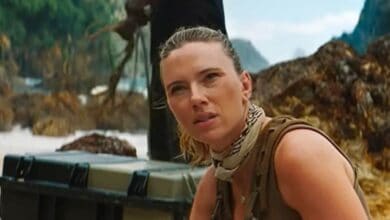 Natasha Romanoff on a beach in a Jurassic World 5 scene.