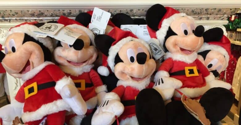 Santa Mickey Mouse plush toys available for mobile checkout at Disney World.