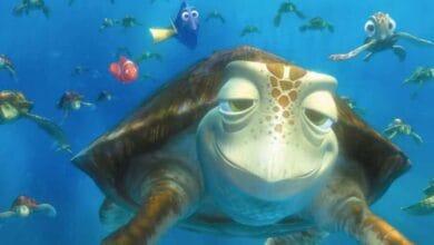 Crush the sea turtle swimming with Nemo, Dory, and Squirt in the Turtle Talk with Crush attraction at Disney Parks.
