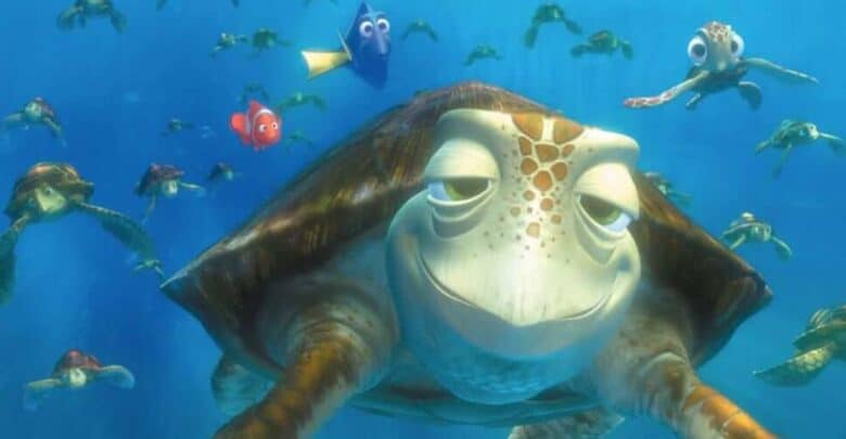 Crush the sea turtle swimming with Nemo, Dory, and Squirt in the Turtle Talk with Crush attraction at Disney Parks.