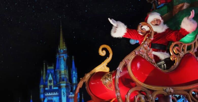 Santa Claus waving from his sleigh in front of Cinderella Castle at Magic Kingdom.