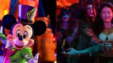 Mickey Mouse in his Halloween costume dancing with guests at a Disney Halloween party.